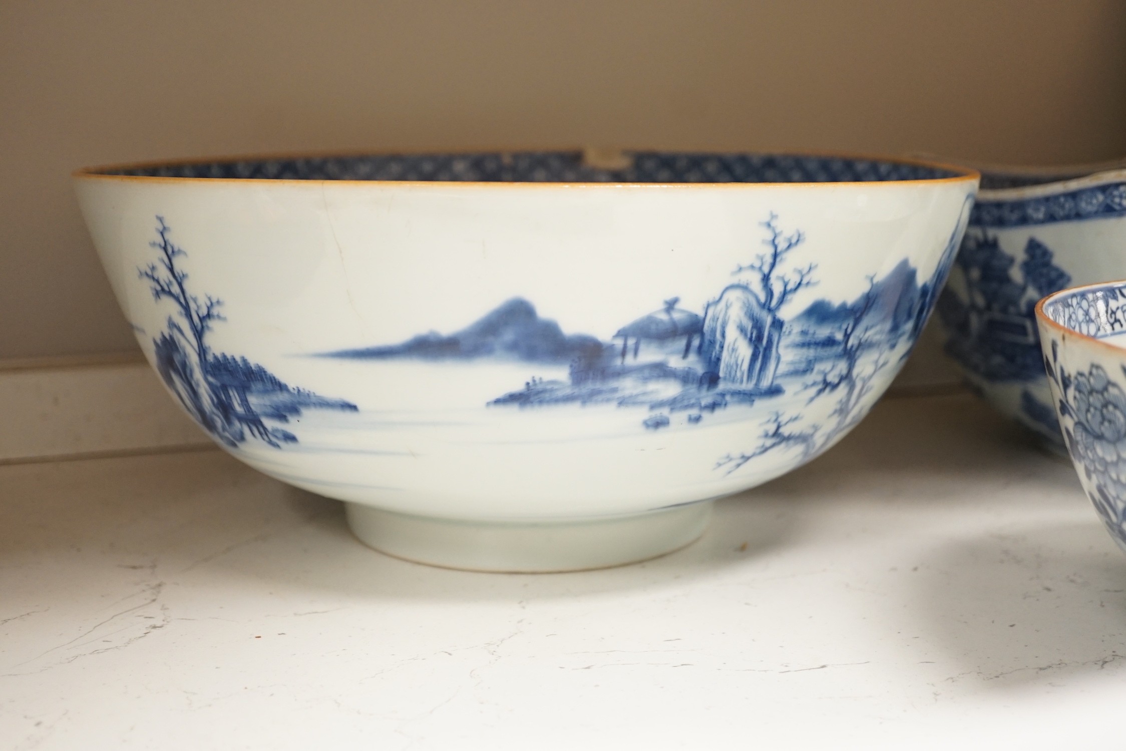 A selection of 18th century blue and white Chinese export bowls and dishes, largest 31cm diameter